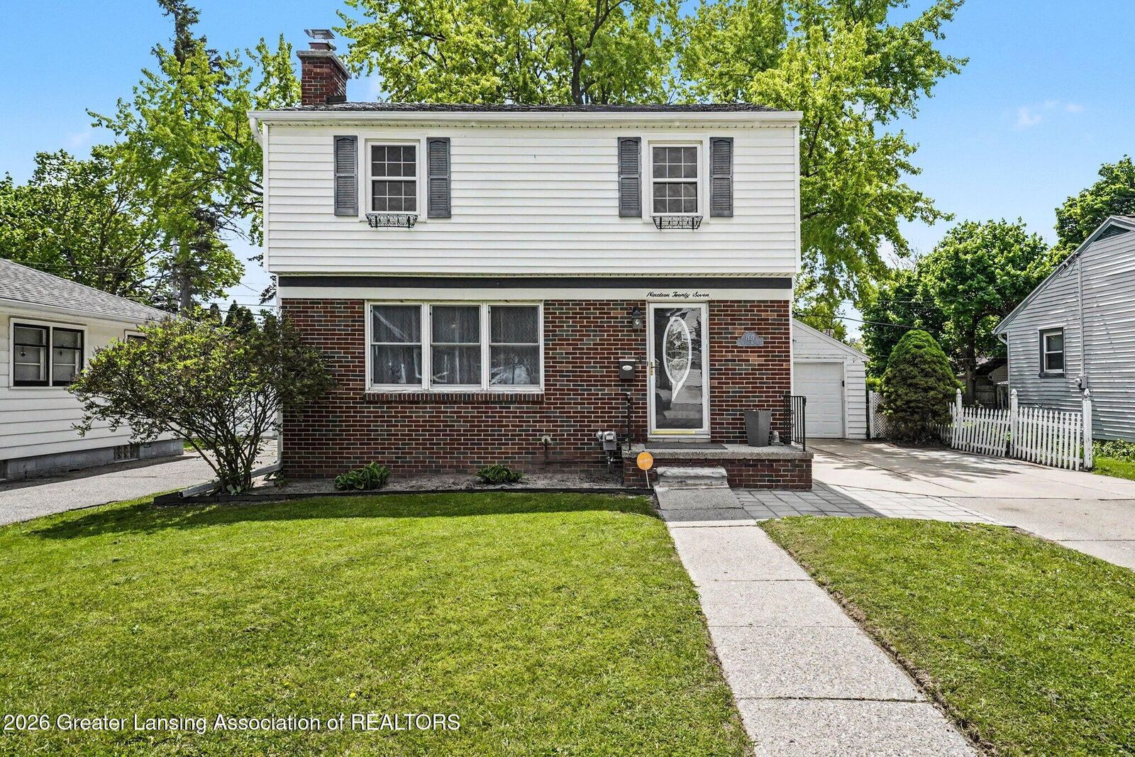 Property Photo:  1927 Cooper Avenue  MI 48910 