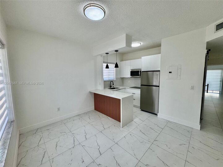 Property Photo:  421 NW 13th Ave A  FL 33125 