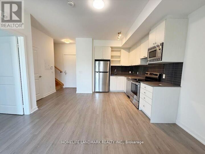 Property Photo:  155 Downsview Park Boulevard 214  ON M3K 0E3 