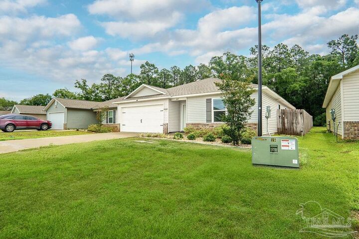 Property Photo: 6469 June Bug Dr FL 32583