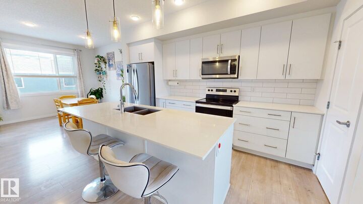 Property Photo: 2093 Maple Road NW AB T6T 2S8