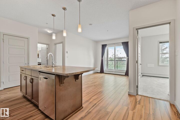 Property Photo:  320 Ambleside Link SW 218  AB T6W 2Z9 