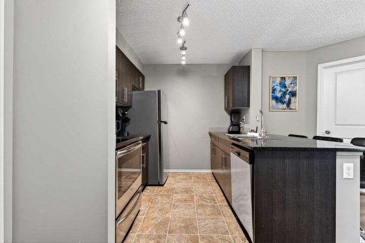 Property Photo:  403 Mackenzie Way SW 9103  AB T4B 3V7 
