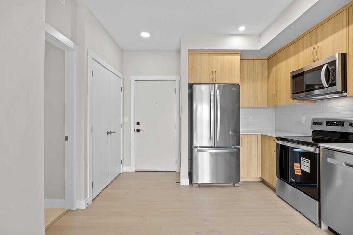 Property Photo: 100 Banister Drive 3306 AB T1S 5Y4