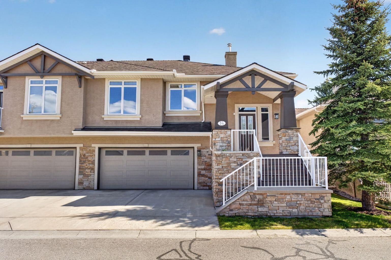 Property Photo: 14 Discovery Woods Villas SW AB T2H 5A6