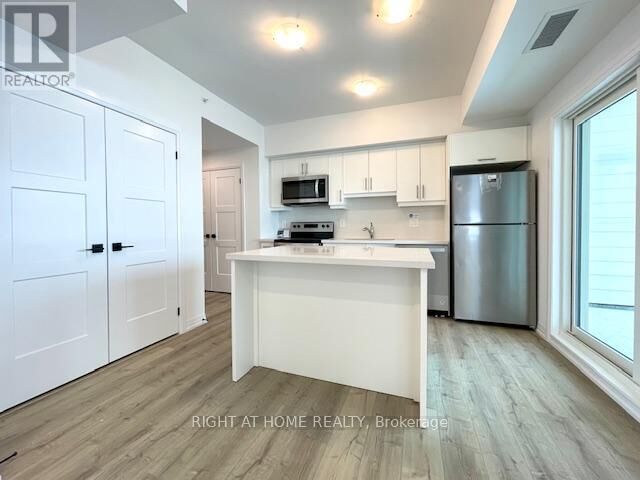 Property Photo: 15 Kneeshaw Drive 102 ON L9J 0X9