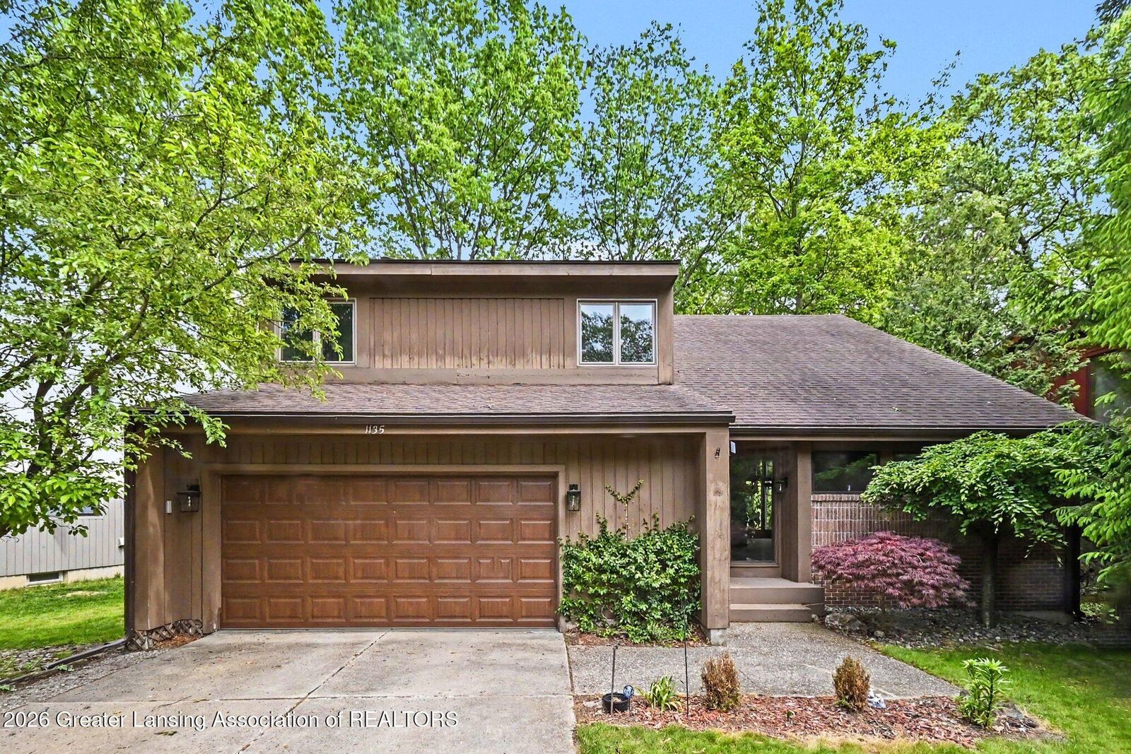 Property Photo:  1135 Woodwind Trail  MI 48840 
