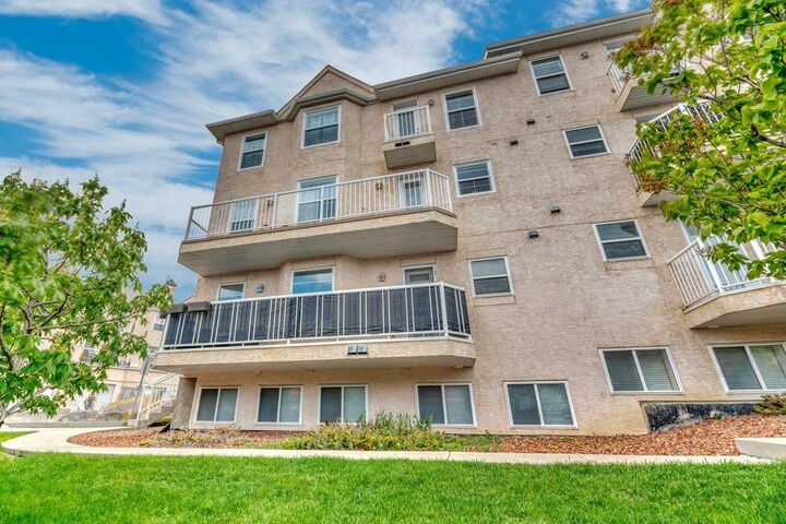 Property Photo:  50 Westland Road 300  AB T1S 1N1 