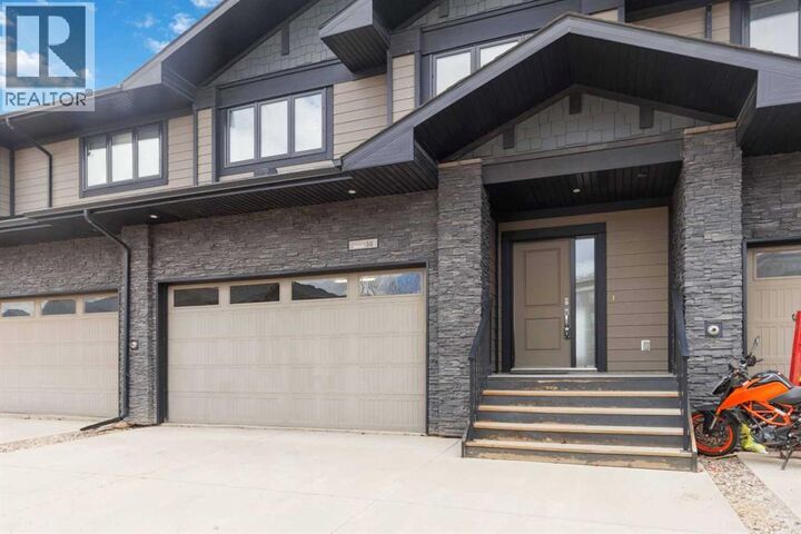 Property Photo:  208 Sparrow Hawk Drive  AB T9K 0Y8 
