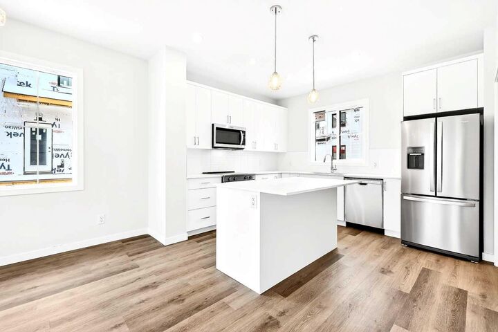 Property Photo: 40 Creekside Way SW 107 AB T2X 6E2