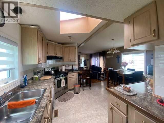 Property Photo:  30 Lake Stafford Crescent East  AB T1R 0P5 