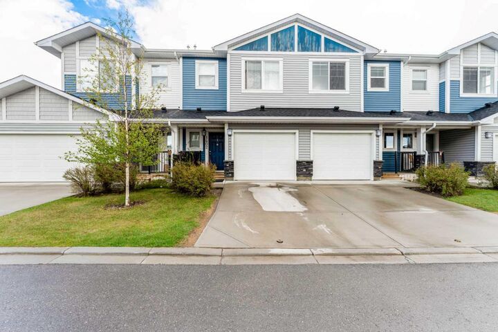 Property Photo:  1402 Jumping Pound Common  AB T4C 2L1 