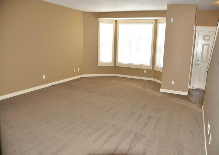 Property Photo: 233 Rainbow Falls Drive AB T1X 0B1