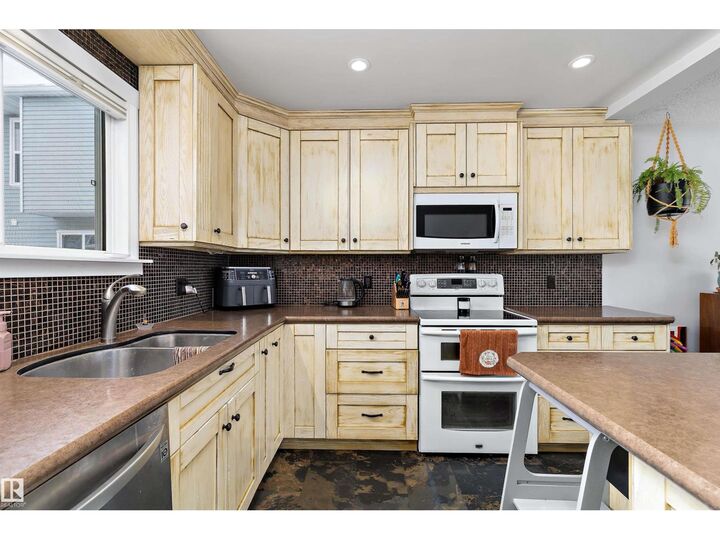 Property Photo:  #9 4403 Riverbend Rd NW  AB T6H 5S9 
