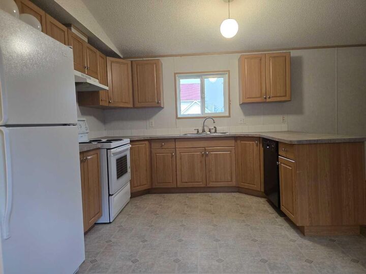 Property Photo: 72133 Range Road 11 302 AB T0H 1B0
