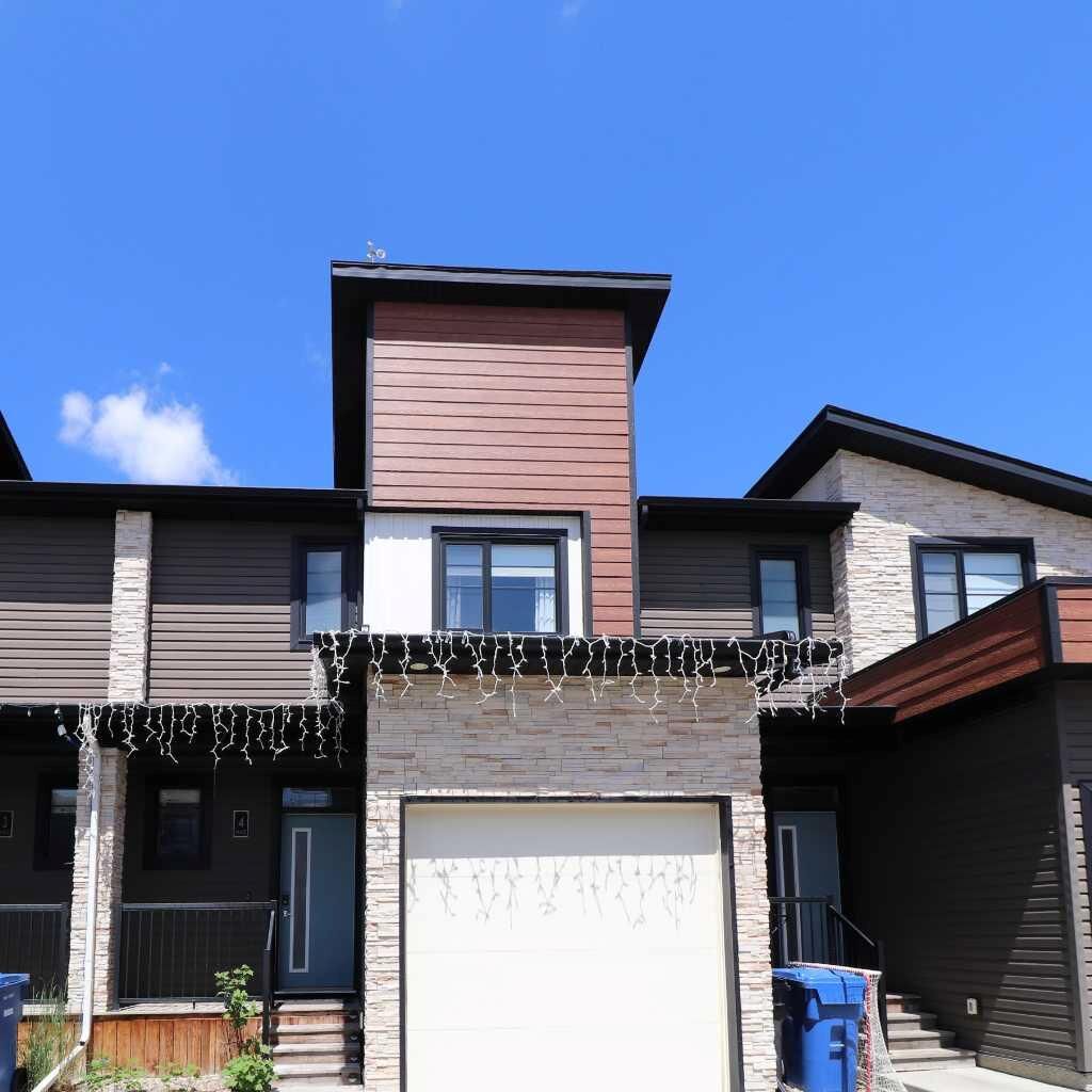 Property Photo:  442 Highlands Boulevard W 4  AB T1J 5K5 