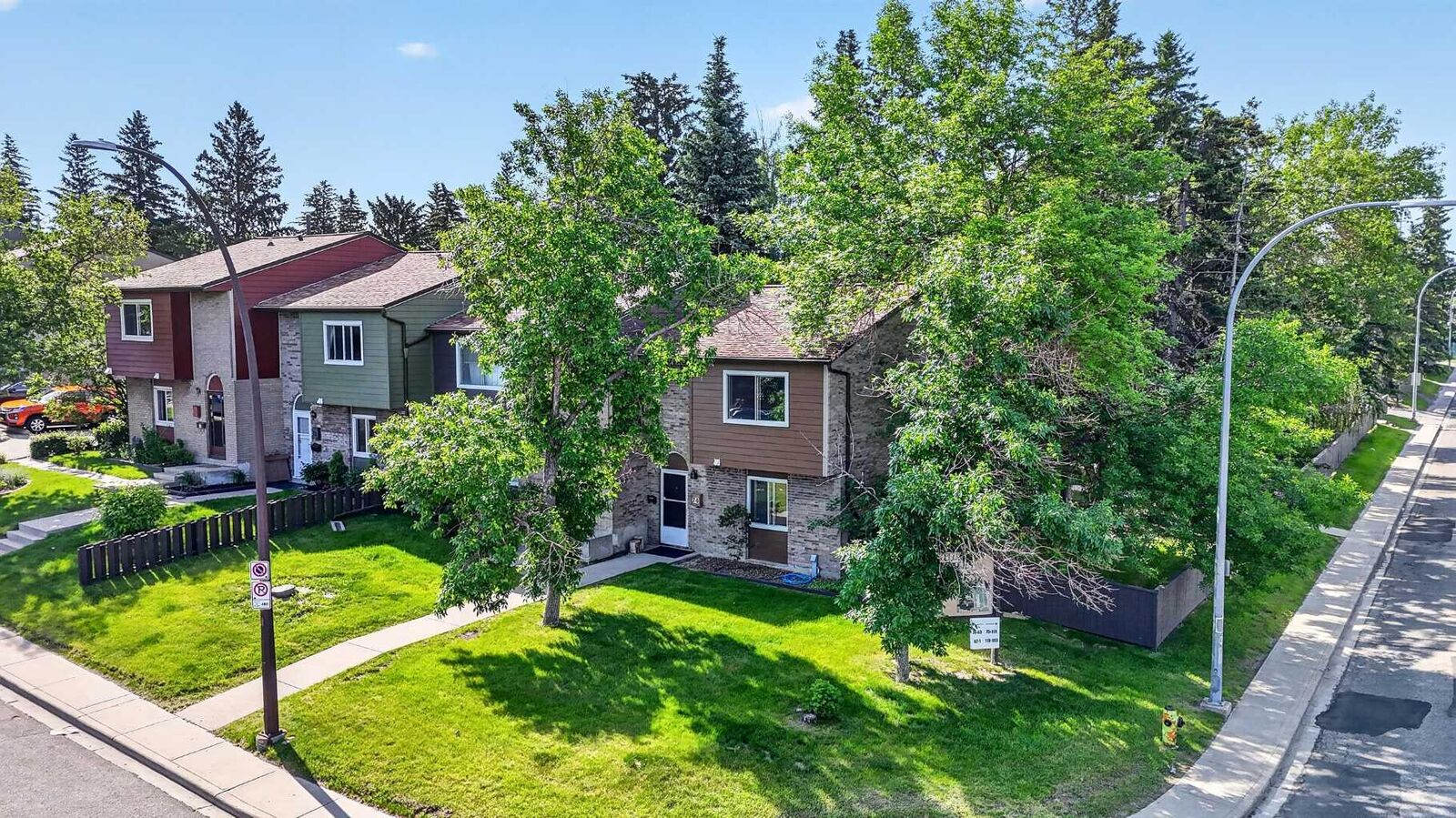 Property Photo:  210 86 Avenue SE 74  AB T2H 1N6 