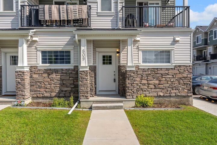 Property Photo: 115 Sagewood Drive SW 809 AB T4B 4V5