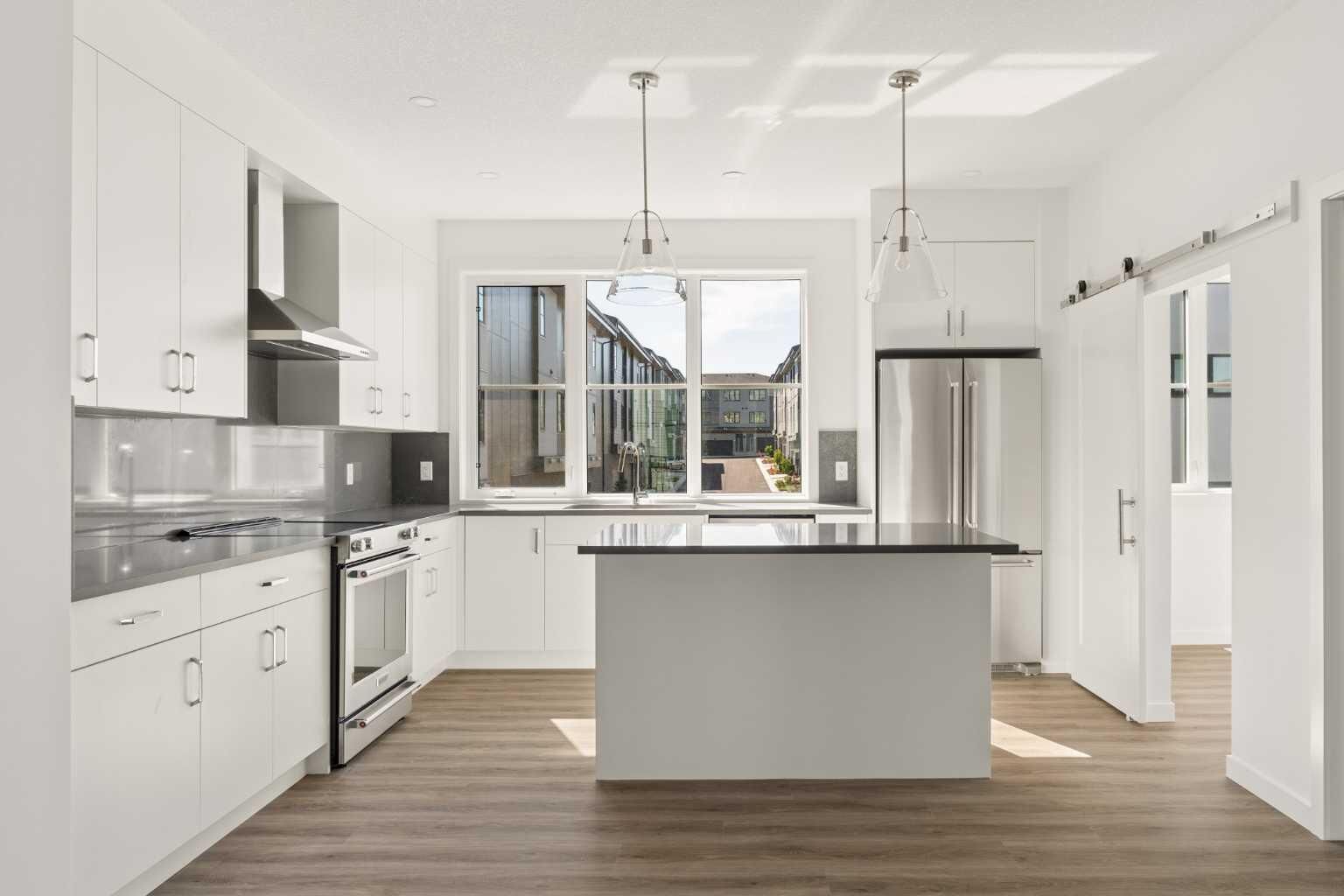 Property Photo: 1453 Naa Drive SW 401 AB T3H 6H7