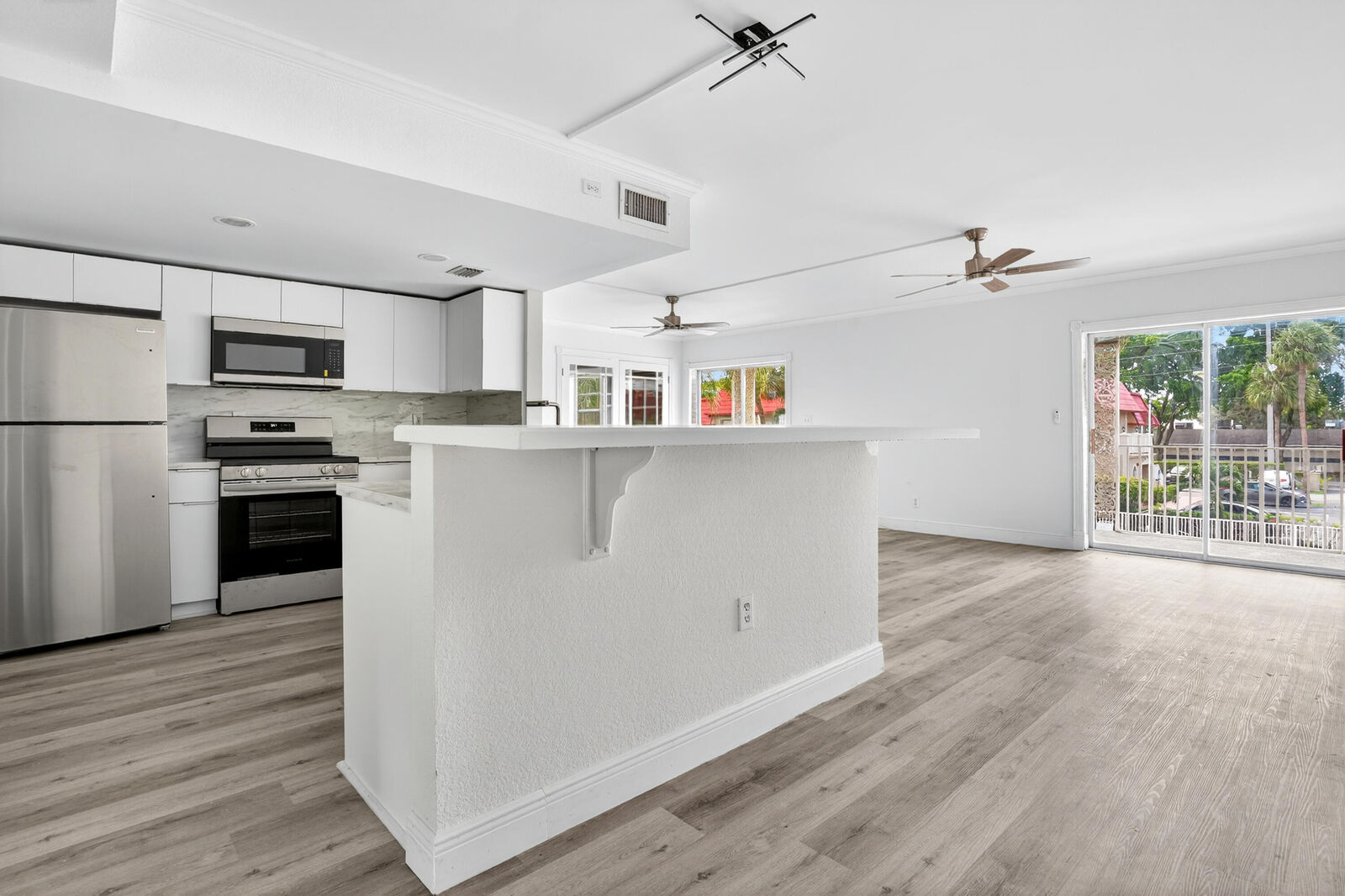 Property Photo:  495 SE 8th Street 242  FL 33441 