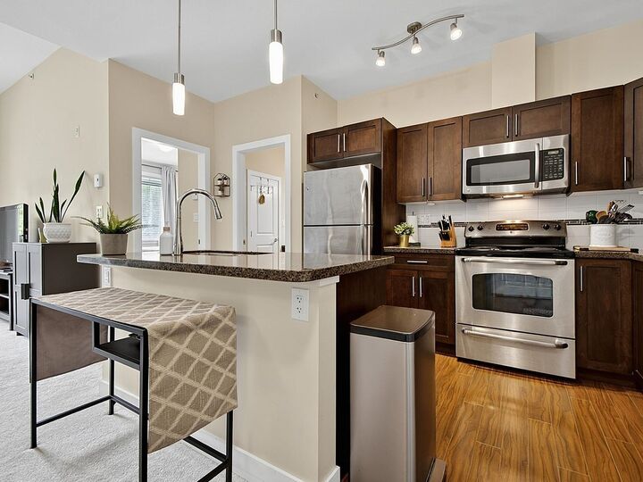 Property Photo: 33898 Pine Street 404 BC V2S 2P3