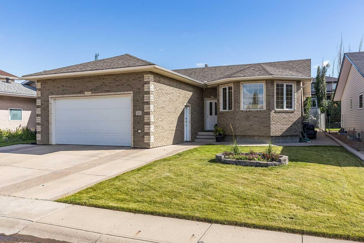 Property Photo:  213 Sunrise Circle SW  AB T1B 4N9 