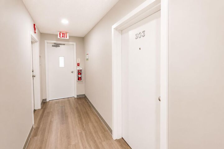 Property Photo: 5555 Falsbridge Drive NE 303 AB T3J 3E8