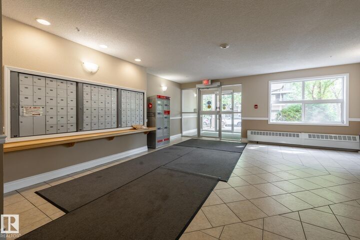 Property Photo: 12838 65 Street NW 103 AB T5A 5H3