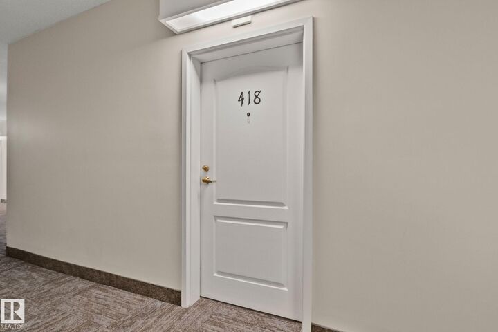 Property Photo: 14259 50 Street NW 418 AB T5A 5J2