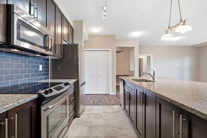 Property Photo:  207 Sunset Drive 306  AB T4C 0H7 