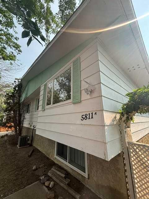 Property Photo:  5811A 50 Street N  AB T1G 1K6 