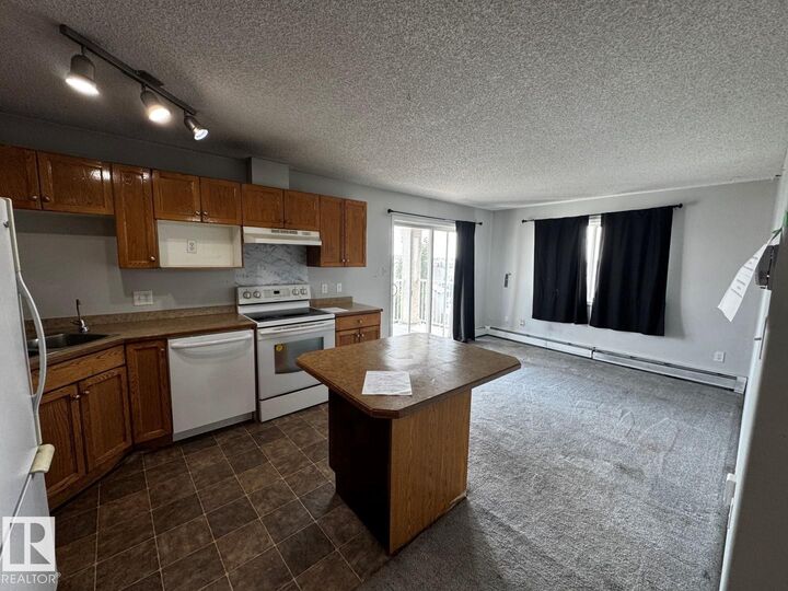 Property Photo:  2305 35A Avenue NW 428  AB T6T 1Z2 