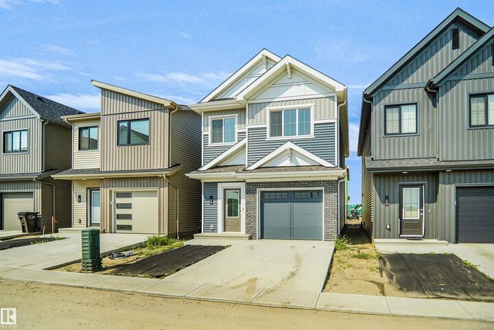 Property Photo: 1430 Aster Way NW 28 AB T6T 2X5