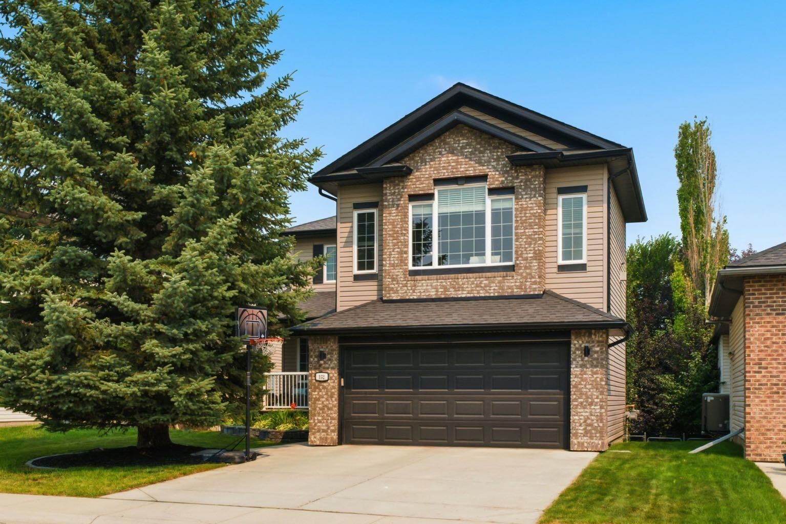 Property Photo:  132 Coopers Heights SW  AB T4B 2S1 