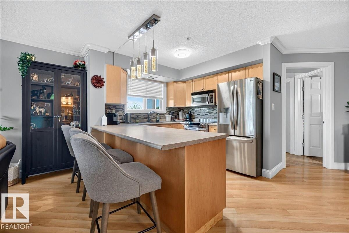 Property Photo:  13111 140 Avenue NW 306  AB T6V 0B1 
