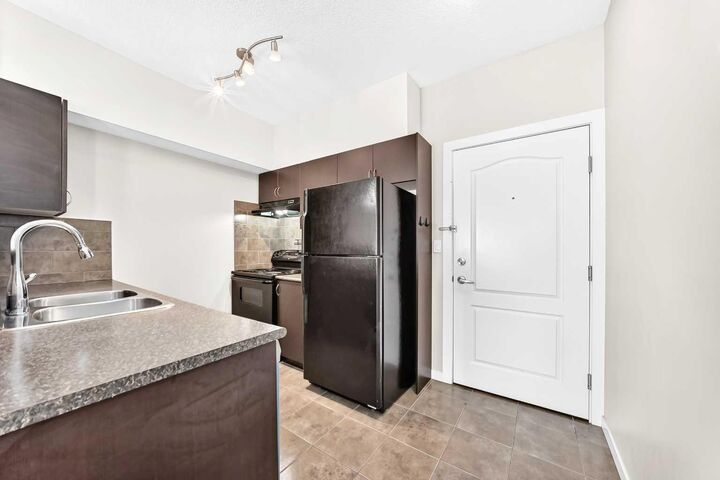 Property Photo:  604 East Lake Boulevard NE 1308  AB T4A 0G6 