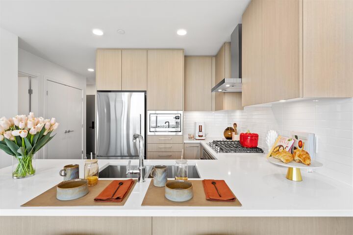 Property Photo: 518 Clarke Road 2705 BC V3J 3X2