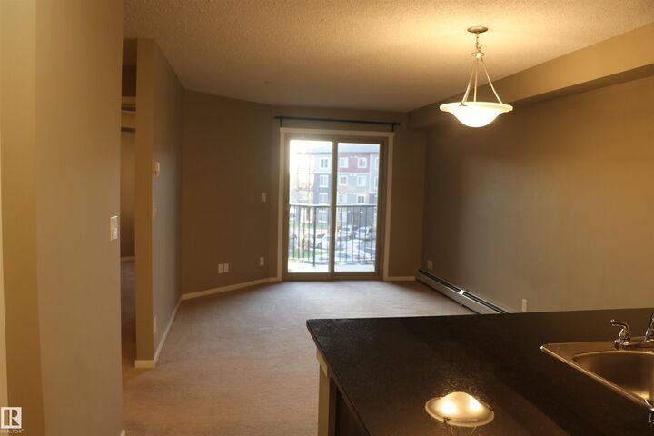 Property Photo: 3207 James Mowatt Trail SW 312 AB T6W 3L6