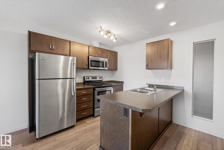 Property Photo: 7711 71 Street NW 405 AB T6B 3J3
