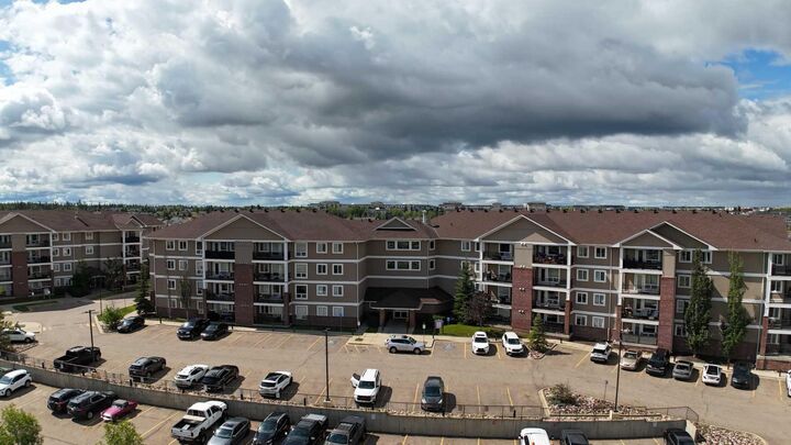 Property Photo: 248A Grosbeak Way 307 AB T9K 0V9