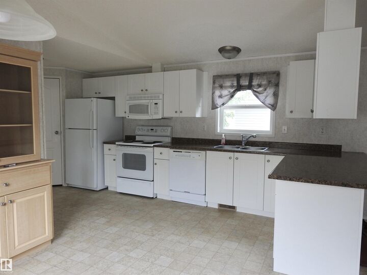 Property Photo: 218 Oak Wood Drive NW AB T6P 0A4