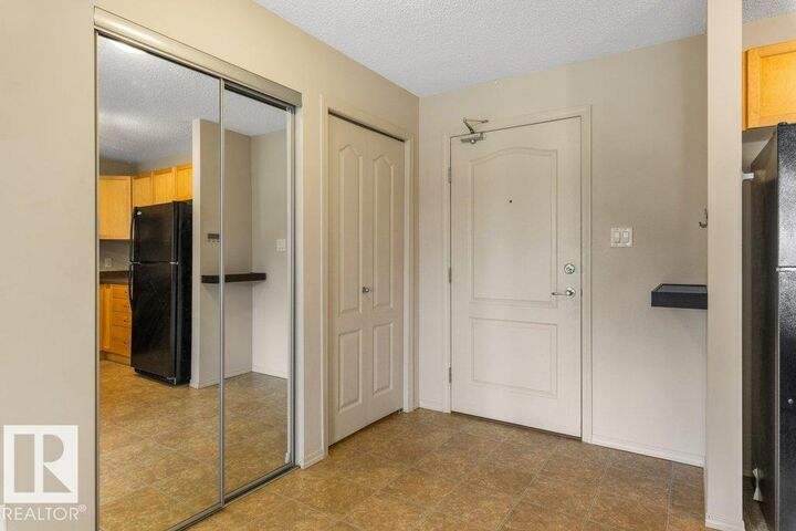 Property Photo:  5951 165 Avenue NW 203  AB T5Y 0J6 