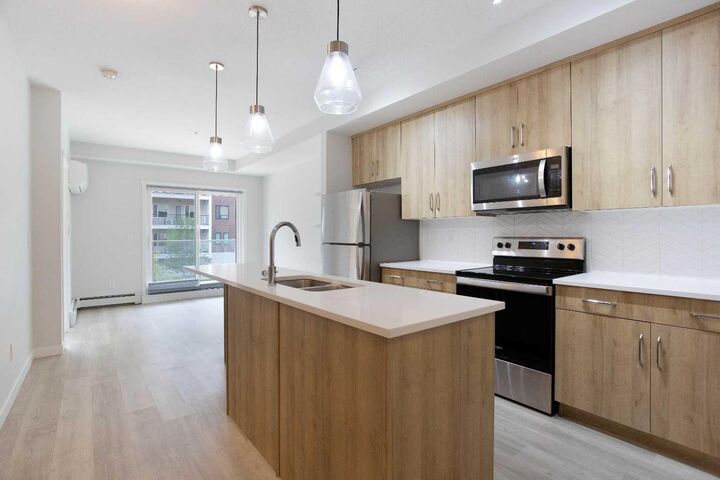 Property Photo:  71 Shawnee Common SW 206  AB T2Y 0R2 
