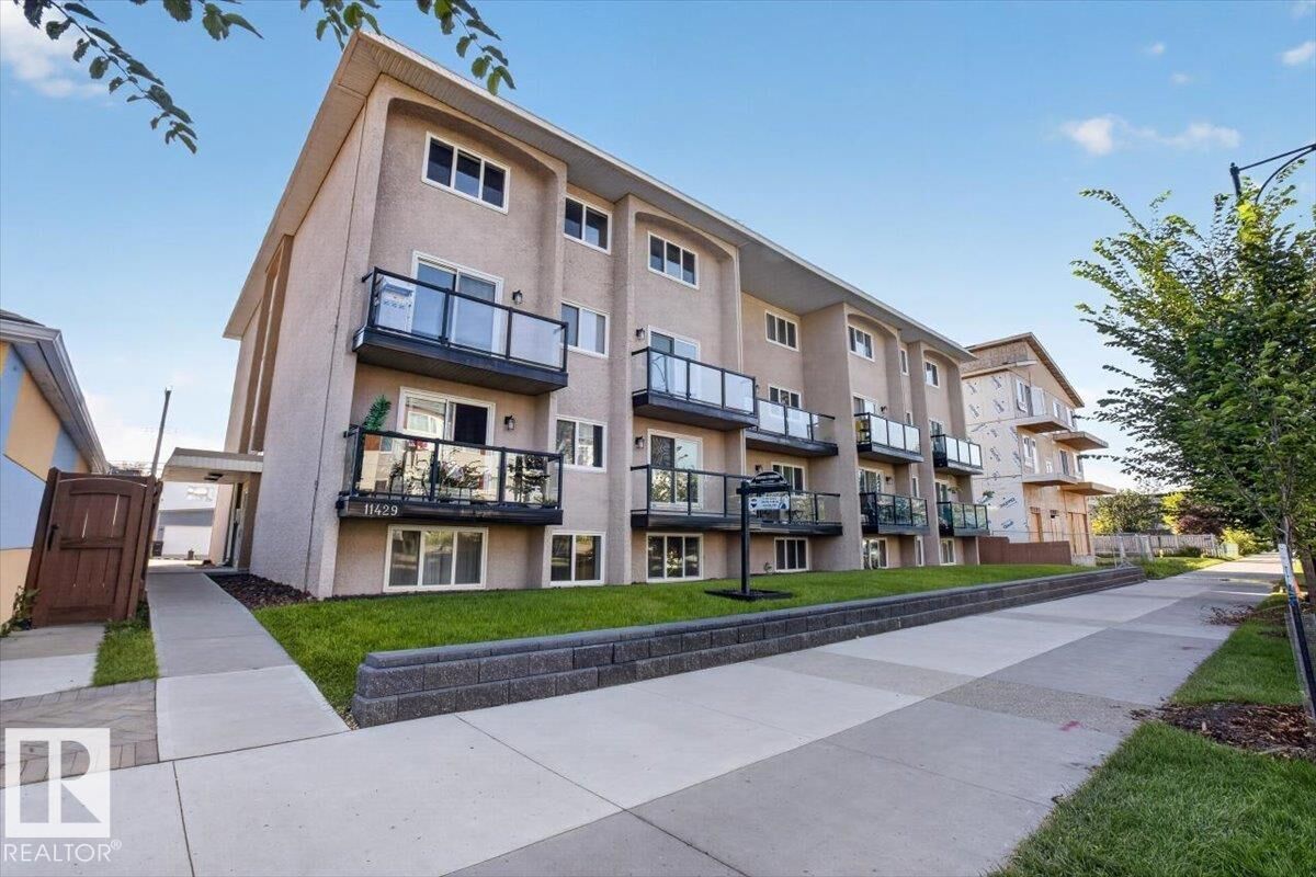 Property Photo:  11429 124 Street NW 205  AB T5M 0K4 