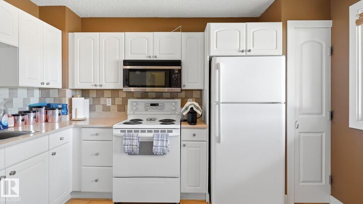 Property Photo:  717 Village Drive  AB T8A 4H9 
