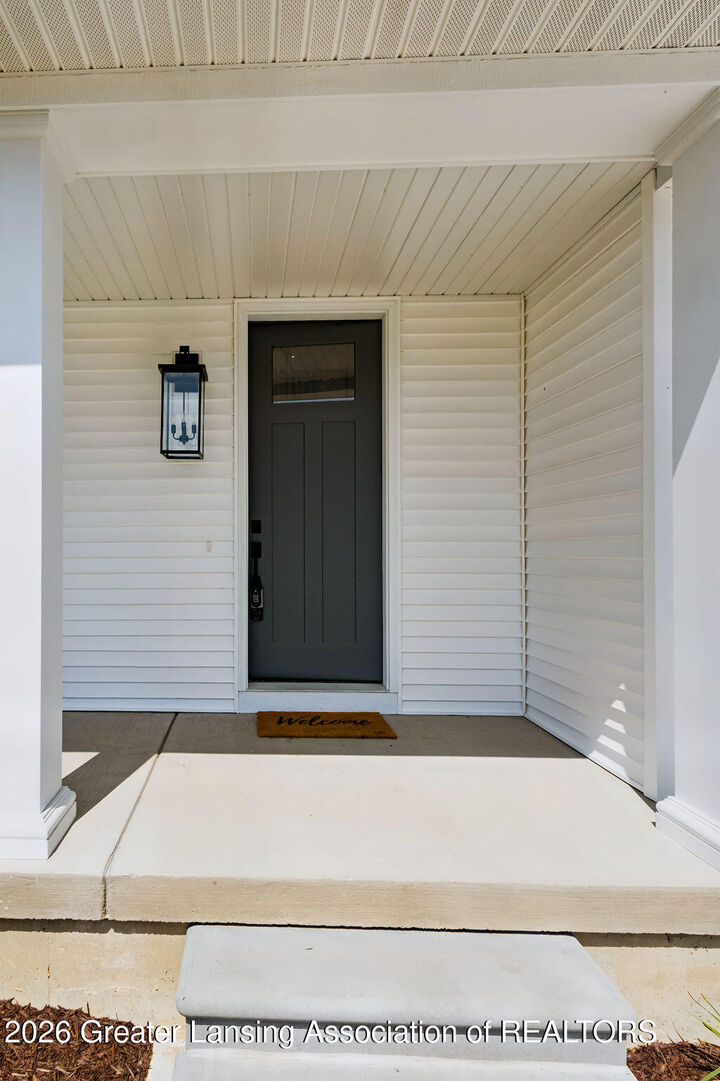 Property Photo:  602 Magenta Court  MI 48840 