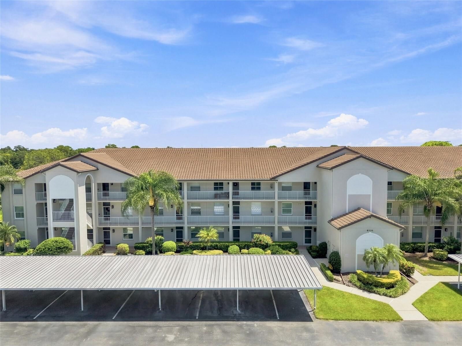 Property Photo:  8735 Olde Hickory Avenue 8304  FL 34238 