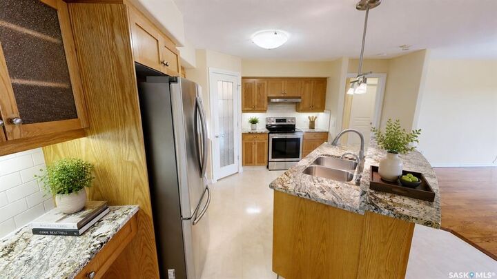 Property Photo: 3101 Renfrew Crescent E 305 SK S4V 3B6