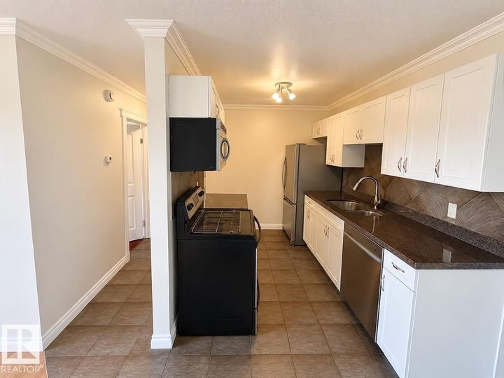 Property Photo:  10904 159 Street NW 9  AB T5P 3C1 