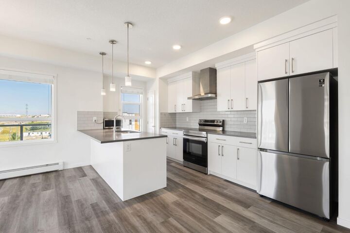 Property Photo: 100 Harvest Hills Place NE 407 AB T3K 2N4